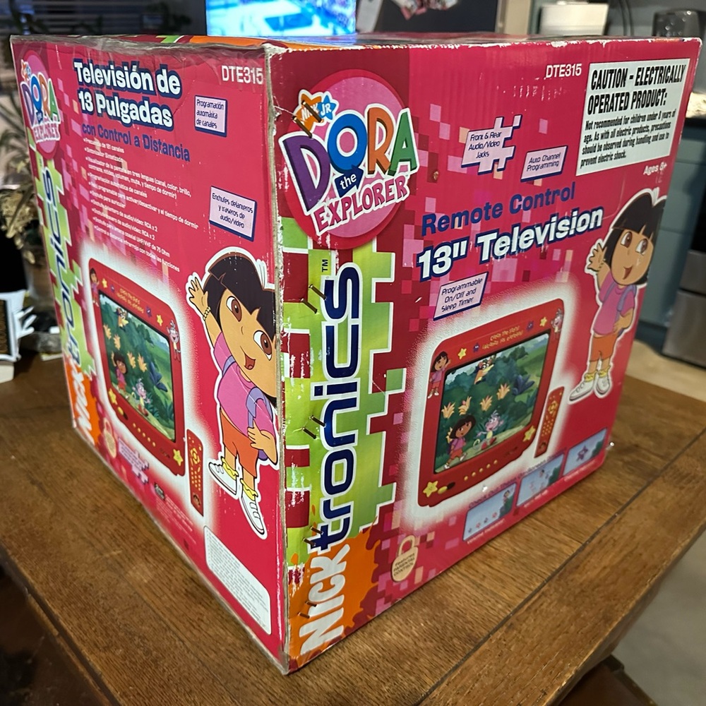 Vintage Dora tv includes the original box, remote, wires, and even manual.